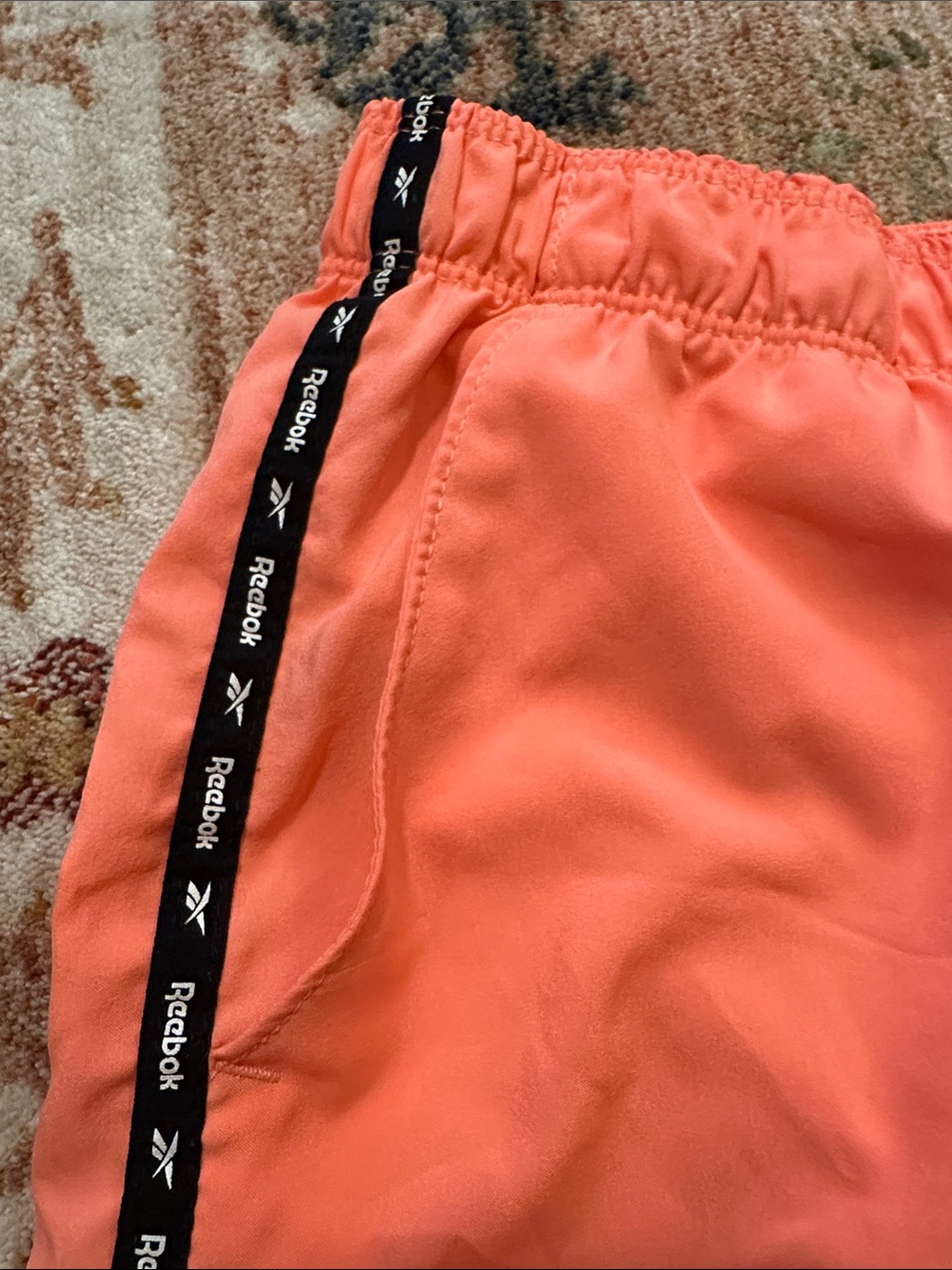Reebok Women's Coral-Orange Athletic Shorts with Black Trim - Picture 5 of 6